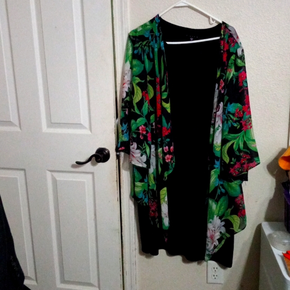 Black dress that is attached to a floral shell.
